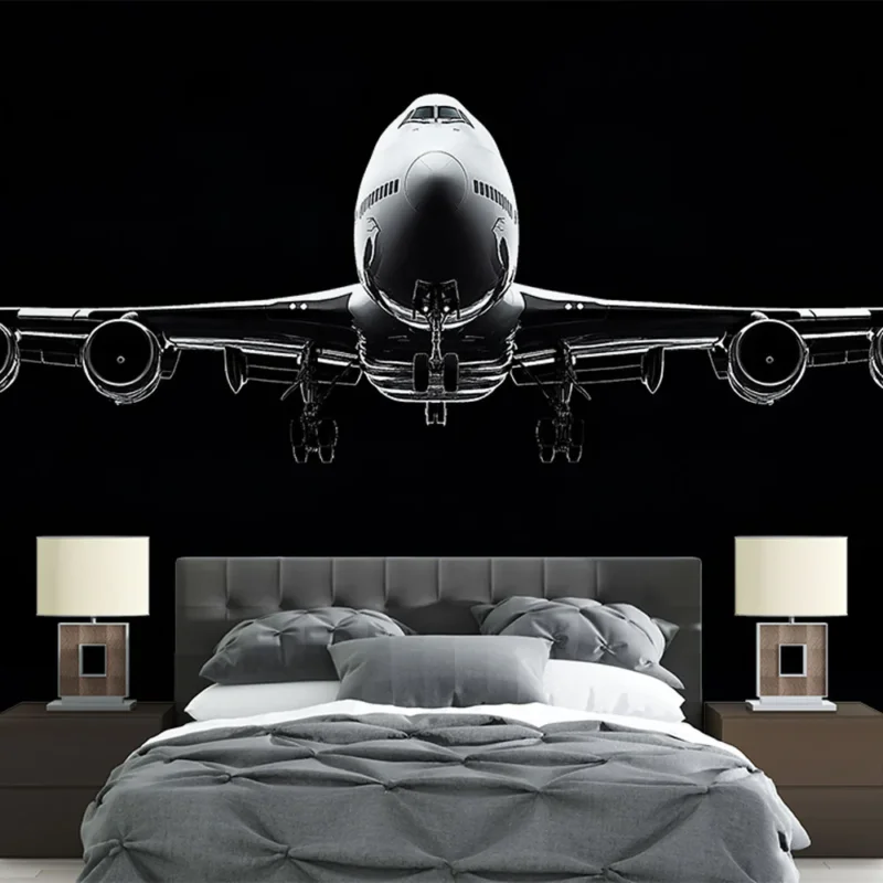 Papier peint avion Silhouette élégante d‘un avion en vol sur fond noir Produit De Marque